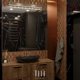 Stylowa łazienka z czarnym marmurem i miedzianymi akcentami. Umywalka nablatowa, drewniana szafka z minimalistycznymi uchwytami i dekoracyjne płytki w kształcie rombów.