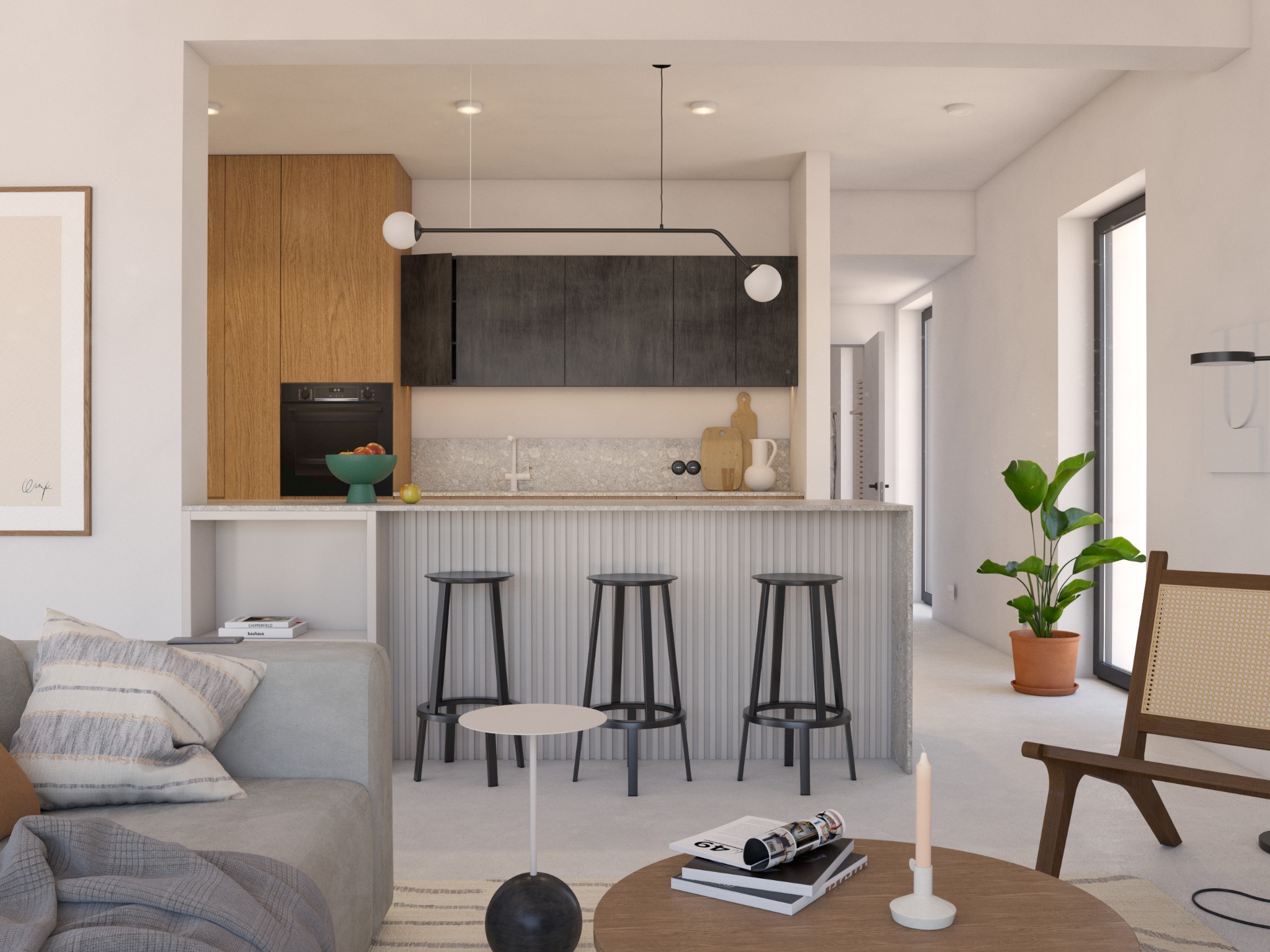Jasne wnętrze mieszkania z wyspą kuchenną, trzema hokerami, drewnianymi szafkami i elementami dekoracyjnymi, takimi jak roślina doniczkowa i owoce w misie.
