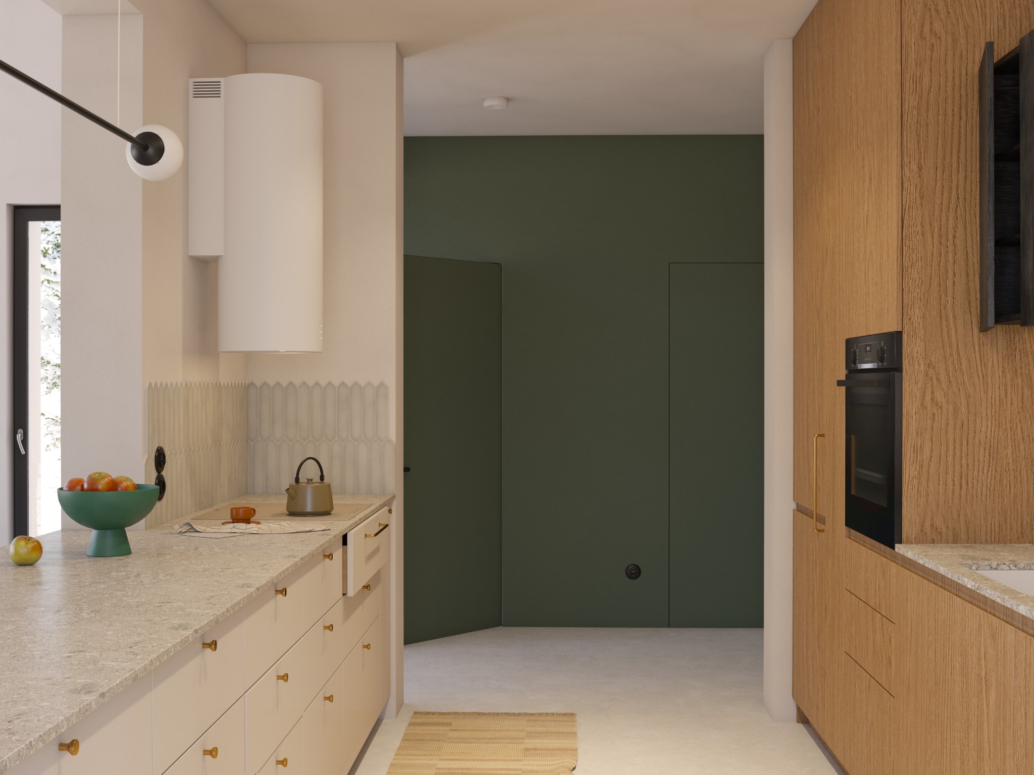 Nowoczesna kuchnia z beżowymi szafkami, złotymi uchwytami, blatem z jasnego kamienia i zieloną ścianą w tle. Na blacie zielona misa z owocami i czajnik.