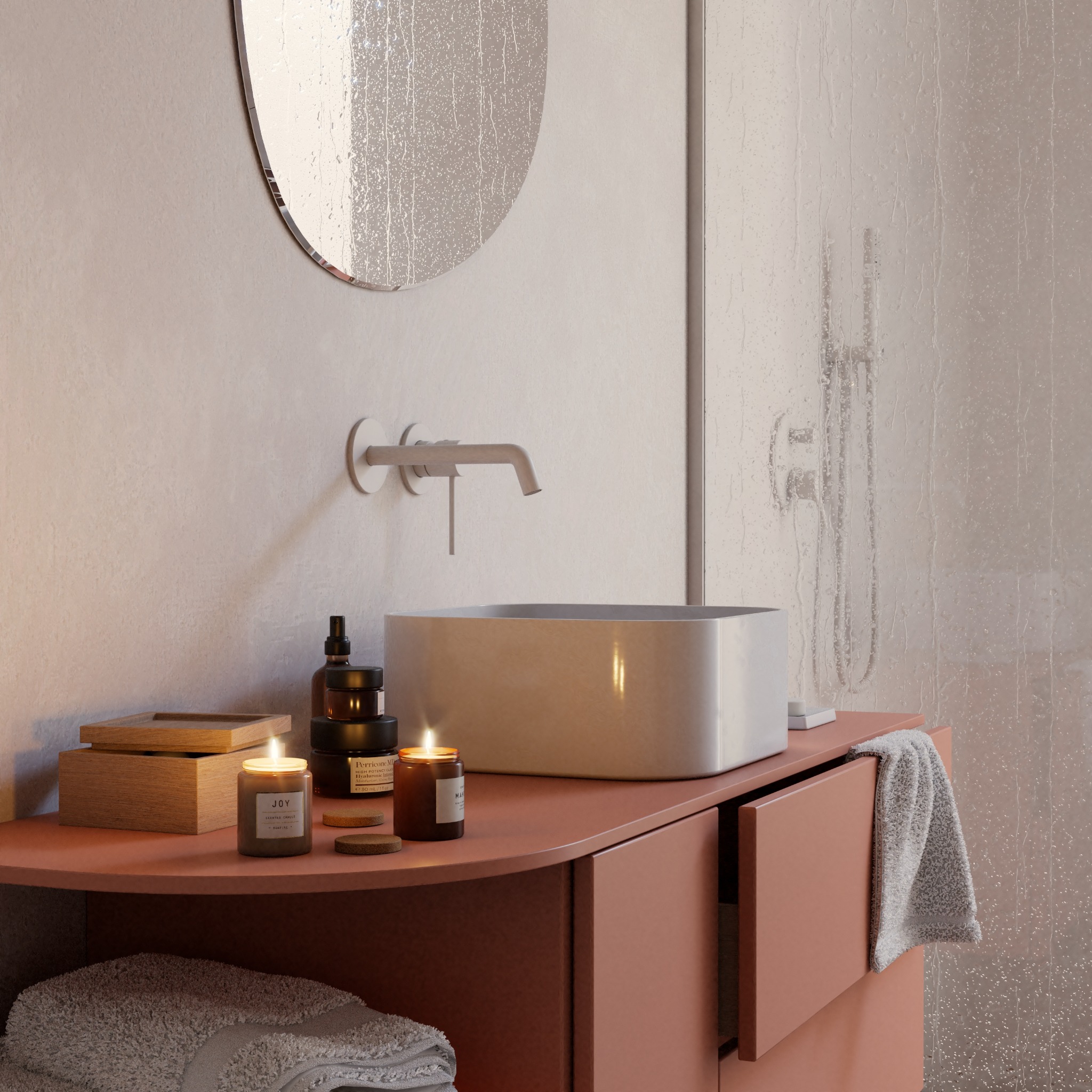 Nowoczesna łazienka z umywalką nablatową, armaturą w kolorze stali, okrągłym lustrem z efektem deszczu i kosmetykami na blacie w odcieniach terakoty.