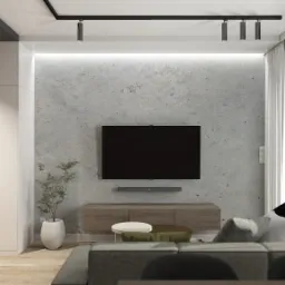 Nowoczesny salon z szarą ścianą imitującą beton, telewizorem, drewnianą szafką RTV, szarą sofą z poduszkami i lampą podłogową, oświetlony listwą z reflektorami.