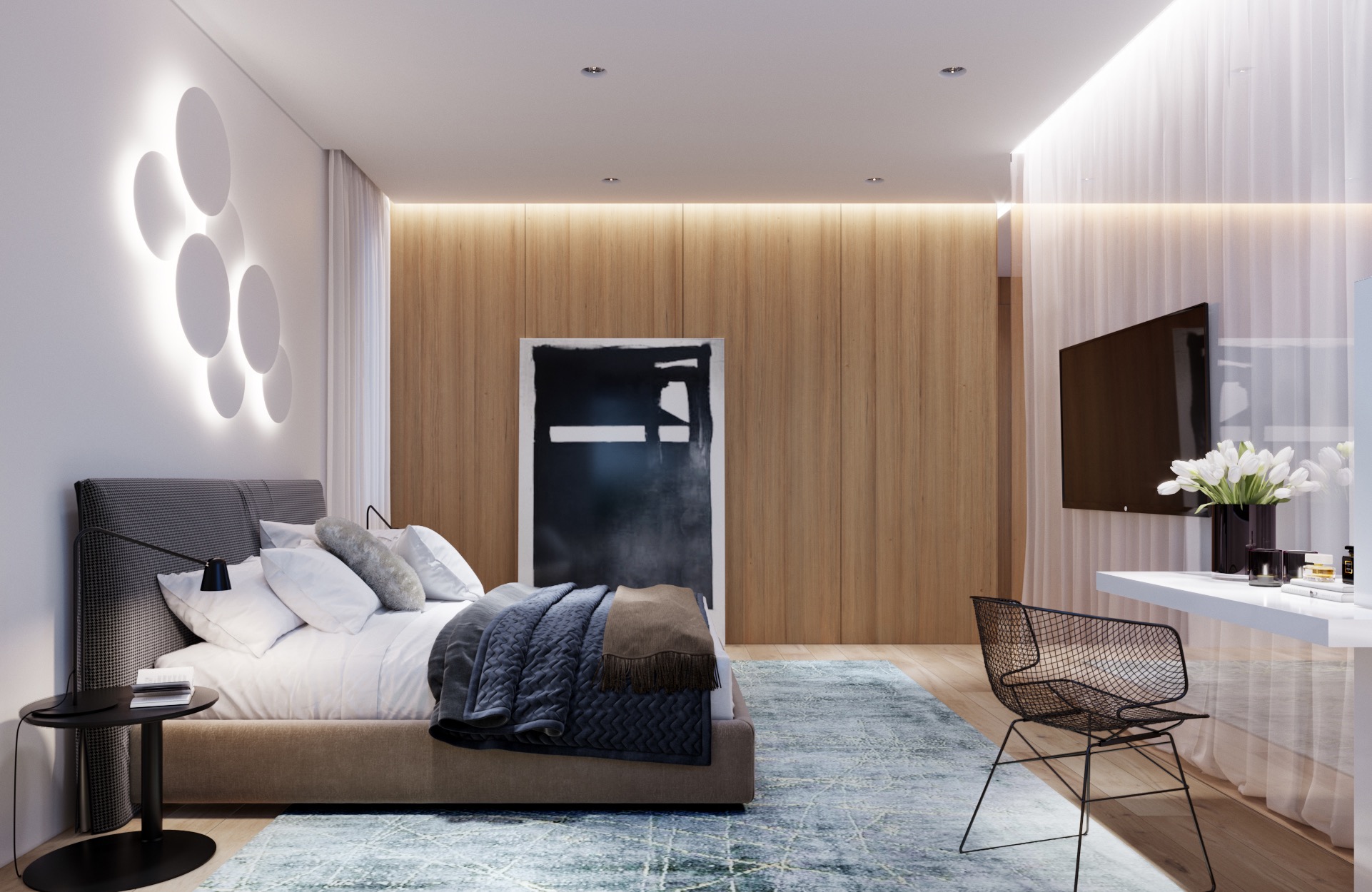 Nowoczesna sypialnia z łóżkiem w kolorze beżowym, wzorzystym zagłówkiem, stolikiem nocnym, designerską lampą na ścianie, abstrakcyjnym obrazem, telewizorem i biurkiem z krzesłem.