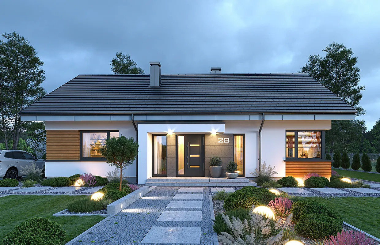 Nowoczesny dom jednorodzinny z szarą dachówką, oświetlonym wejściem i numerem 28, otoczony ozdobnym ogrodem z kulistymi lampami.