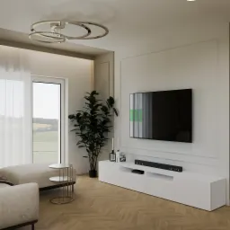 Jasne wnętrze salonu z parkietem w jodełkę, białą szafką RTV, telewizorem, rośliną doniczkową i widokiem na krajobraz za oknem.