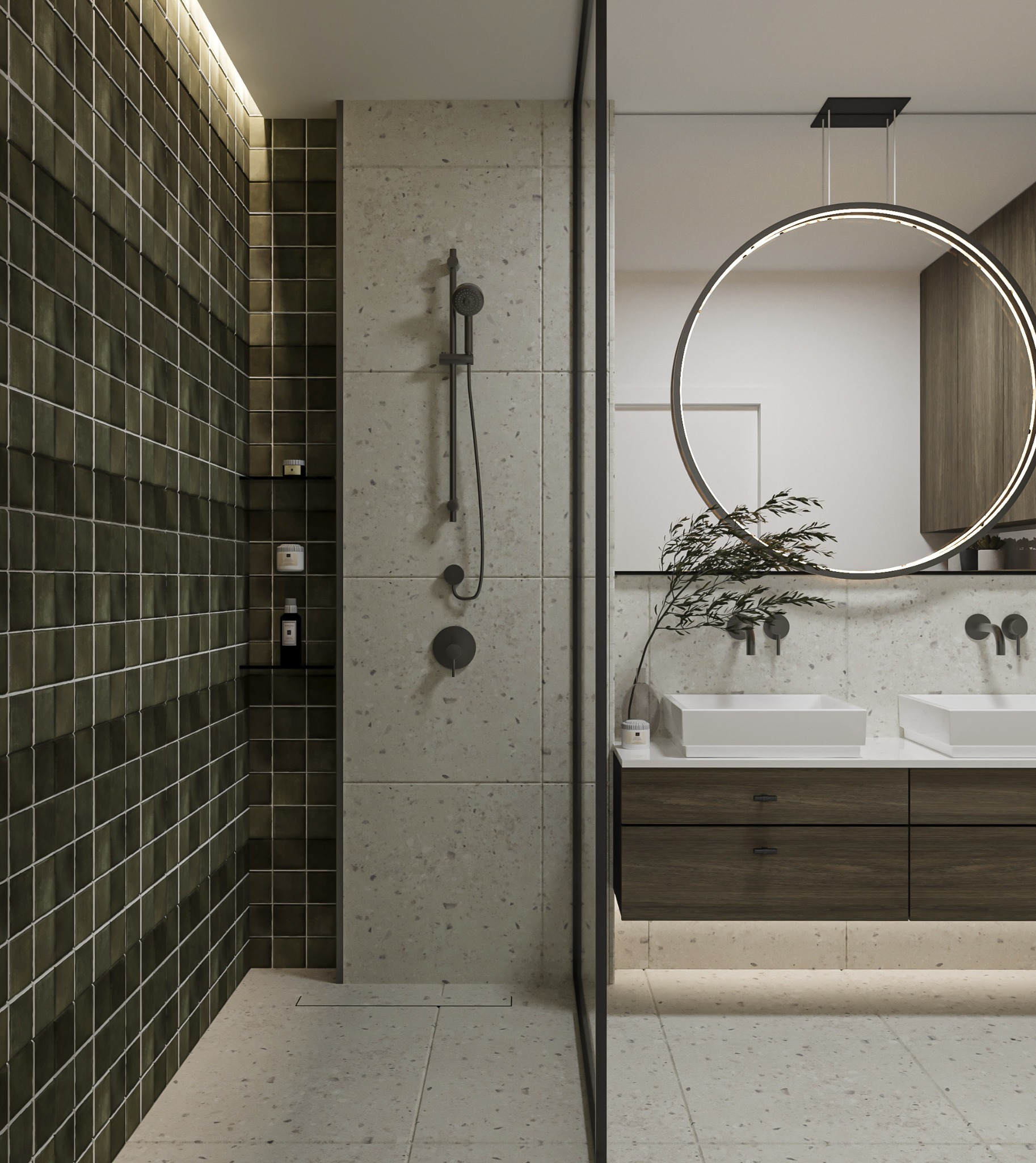 Nowoczesna łazienka z kabiną prysznicową wyłożoną ciemnozielonymi płytkami, armaturą w kolorze grafitu, podwójną umywalką nablatową i okrągłym lustrem podświetlanym LED.