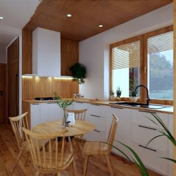 cubeai - projektowanie wnętrz - Jasna kuchnia z drewnianymi akcentami: lamelowy sufit, drewniana podłoga, okno z żaluzjami; okrągły stół i krzesła w stylu skandynawskim; białe szafki z czarnymi uchwytami.