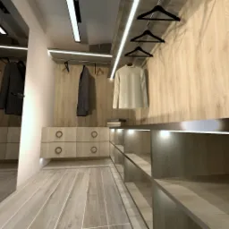 Projekt garderoby z drewnianymi frontami, oświetleniem LED i szufladami z okrągłymi uchwytami, widoczne ubrania na wieszakach.