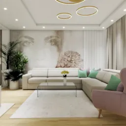 Jasne, przestronne wnętrze salonu z beżową sofą narożną, szklanym stolikiem kawowym, kominkiem z wbudowanym telewizorem, okrągłym zegarem na ścianie i fototapetą z wizerunkiem twarzy kobiety.