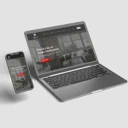 Laptop i smartfon wyświetlają stronę internetową firmy Letryo z aranżacją wnętrza z roletami, prezentacja responsywnego designu.