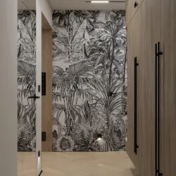 Nowoczesny przedpokój z fototapetą w tropikalne wzory, podświetleniem LED przy podłodze i drewnianą szafą wnękową z długimi, czarnymi uchwytami.