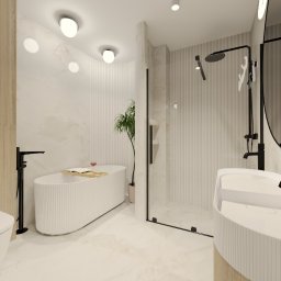 COLIBRIART PRACOWNIA WNĘTRZ EWA ŚWIDERSKA-BASIAK - Nowoczesna łazienka z wolnostojącą wanną, minimalistyczną umywalką i czarną armaturą. Jasne płytki imitujące marmur i subtelne oświetlenie tworzą elegancki klimat.