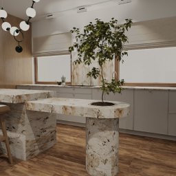 COLIBRIART PRACOWNIA WNĘTRZ EWA ŚWIDERSKA-BASIAK - Nowoczesna kuchnia z wyspą z marmurowym blatem, drewnianymi krzesłami barowymi i rośliną wbudowaną w blat. Jasne szafki i drewniane panele ścienne.