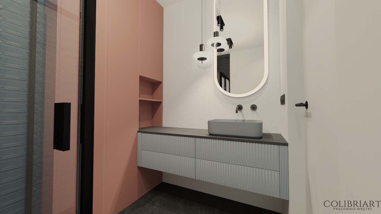 Wizualizacja łazienki z umywalką nablatową, lustrem owalnym i szafką z ryflowanym frontem. Uwagę zwraca kolorystyka: pudrowy róż i szaro-błękitne odcienie.
