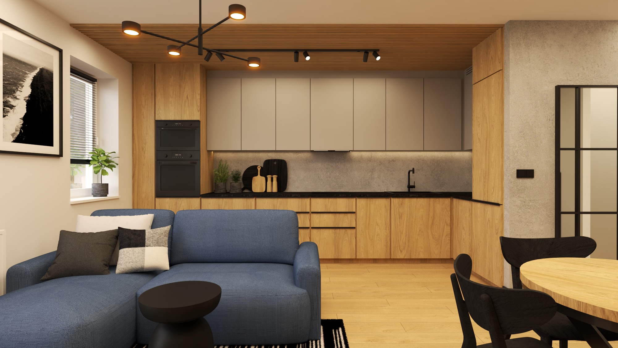 Salon z aneksem kuchennym w ciepłych barwach: drewniane szafki, szara ściana, niebieska sofa i czarne akcenty oświetleniowe. Nowoczesny design.