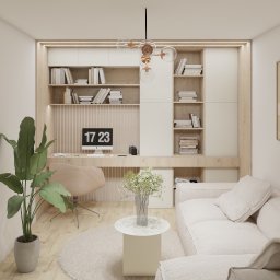 Jagoda Nowak Pracownia Projektowa - Jasne wnętrze z biurkiem w zabudowie, regałami, beżową sofą i okrągłym dywanem, oświetlone nowoczesną lampą wiszącą z kulistymi kloszami.