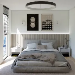 Nowoczesna sypialnia z łóżkiem kontynentalnym, drewnianym panelem za wezgłowiem podświetlonym LED, minimalistycznymi lampkami nocnymi i abstrakcyjnymi obrazami w czarno-białej kolorystyce.