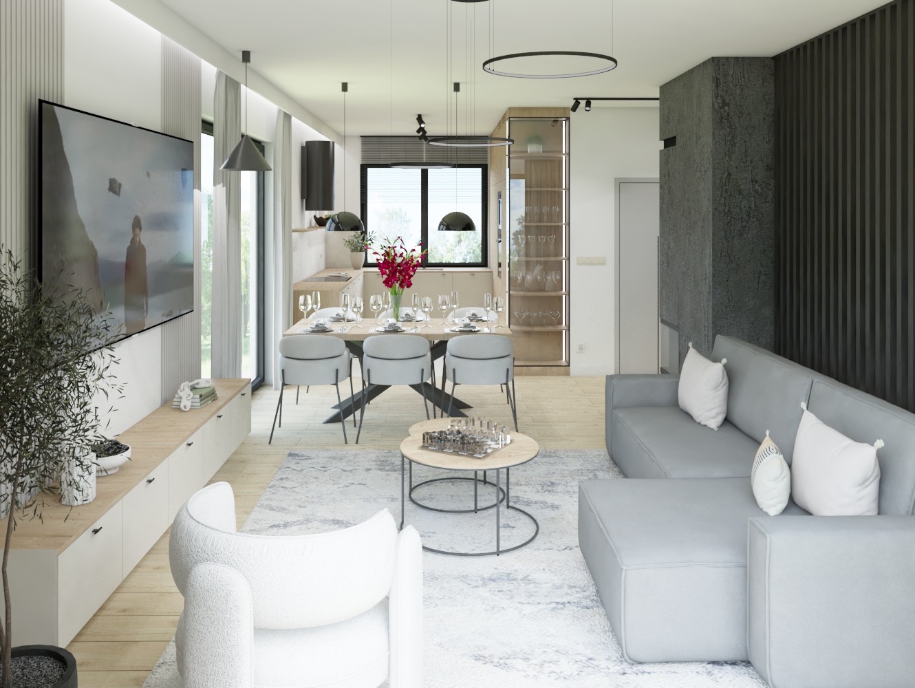 Wizualizacja przestronnego wnętrza mieszkania z otwartą kuchnią, jadalnią i salonem w odcieniach szarości i bieli, z dużym telewizorem na ścianie i dekoracyjną rośliną w donicy.