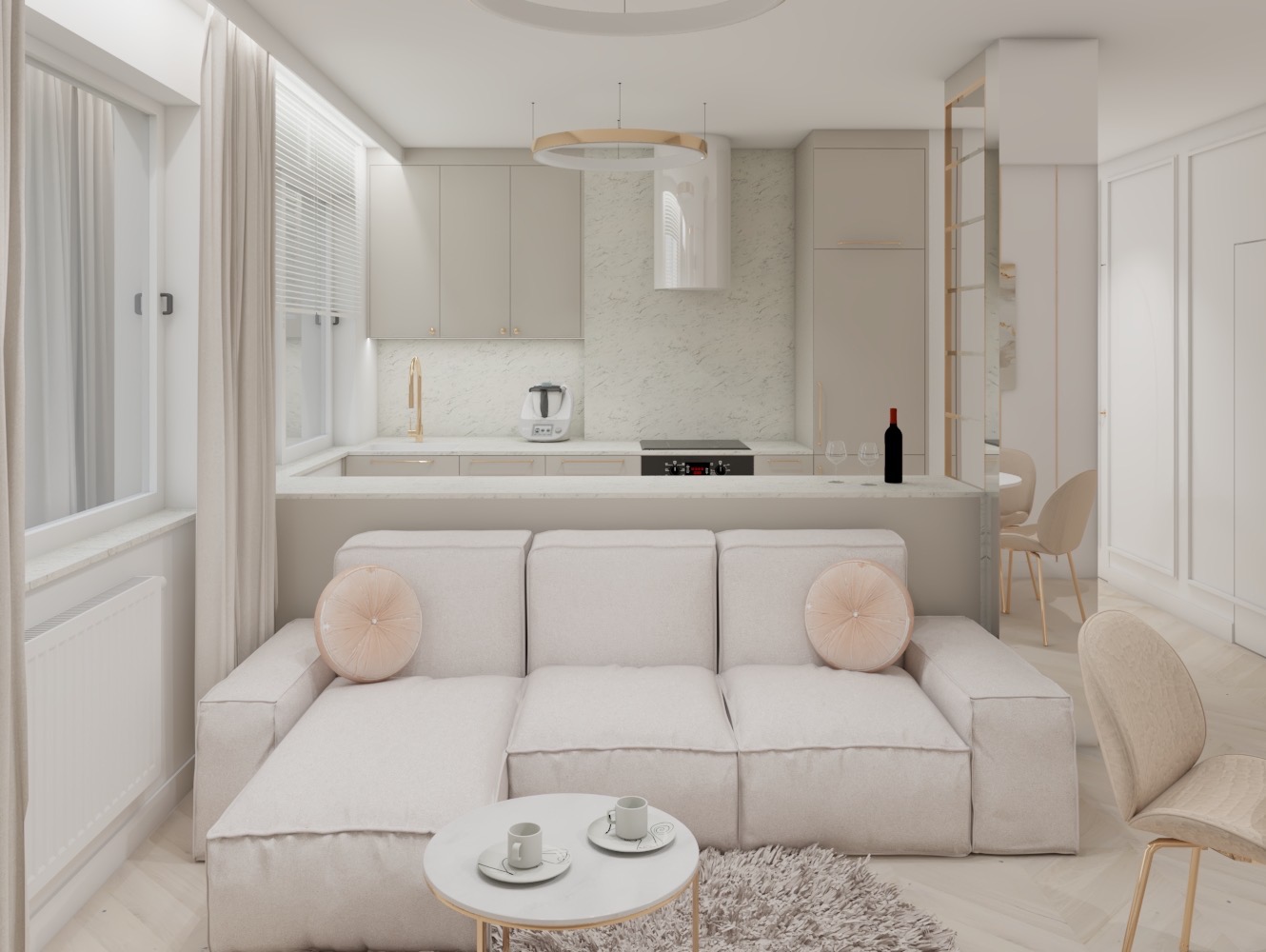 Jasne wnętrze: salon z aneksem kuchennym w minimalistycznym stylu, beżowa sofa z okrągłymi poduszkami, stolik kawowy z filiżankami, widok na kuchnię z białymi szafkami i marmurkowym blatem.