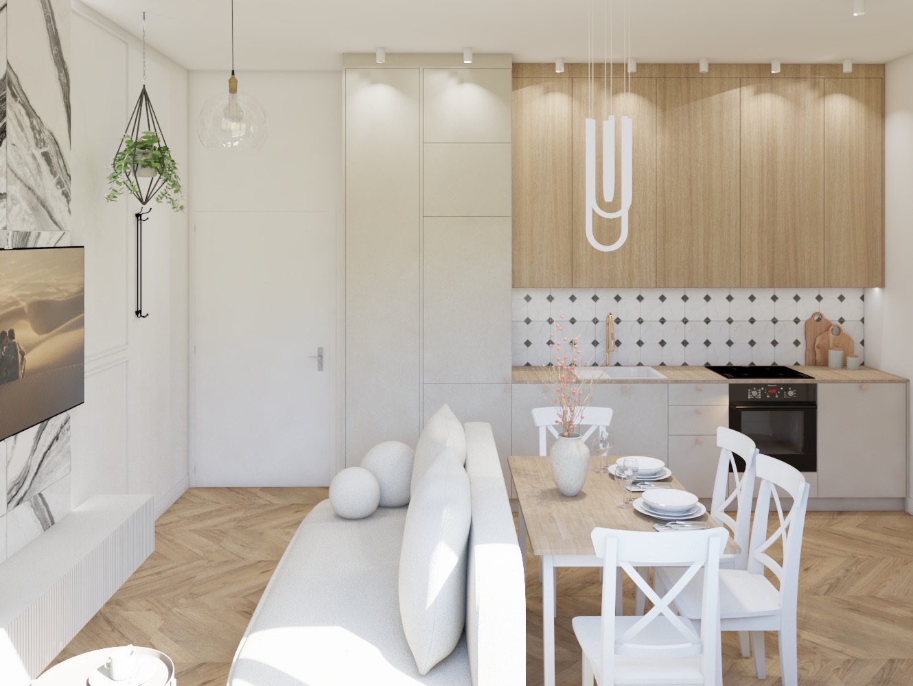 Jasne wnętrze mieszkania z drewnianą podłogą w jodełkę, białą sofą z kulistymi poduszkami, stołem z białymi krzesłami i kuchnią w odcieniach beżu i bieli z dekoracyjną mozaiką nad blatem.