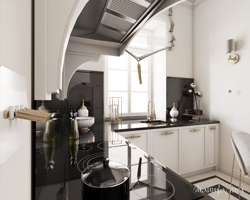 Elegancka kuchnia w czerni i bieli z złotymi akcentami, widoczna płyta indukcyjna z pokrywką, dekoracyjne naczynia i kwiaty, nowoczesny okap z ozdobną szybą, marmurowa podłoga.