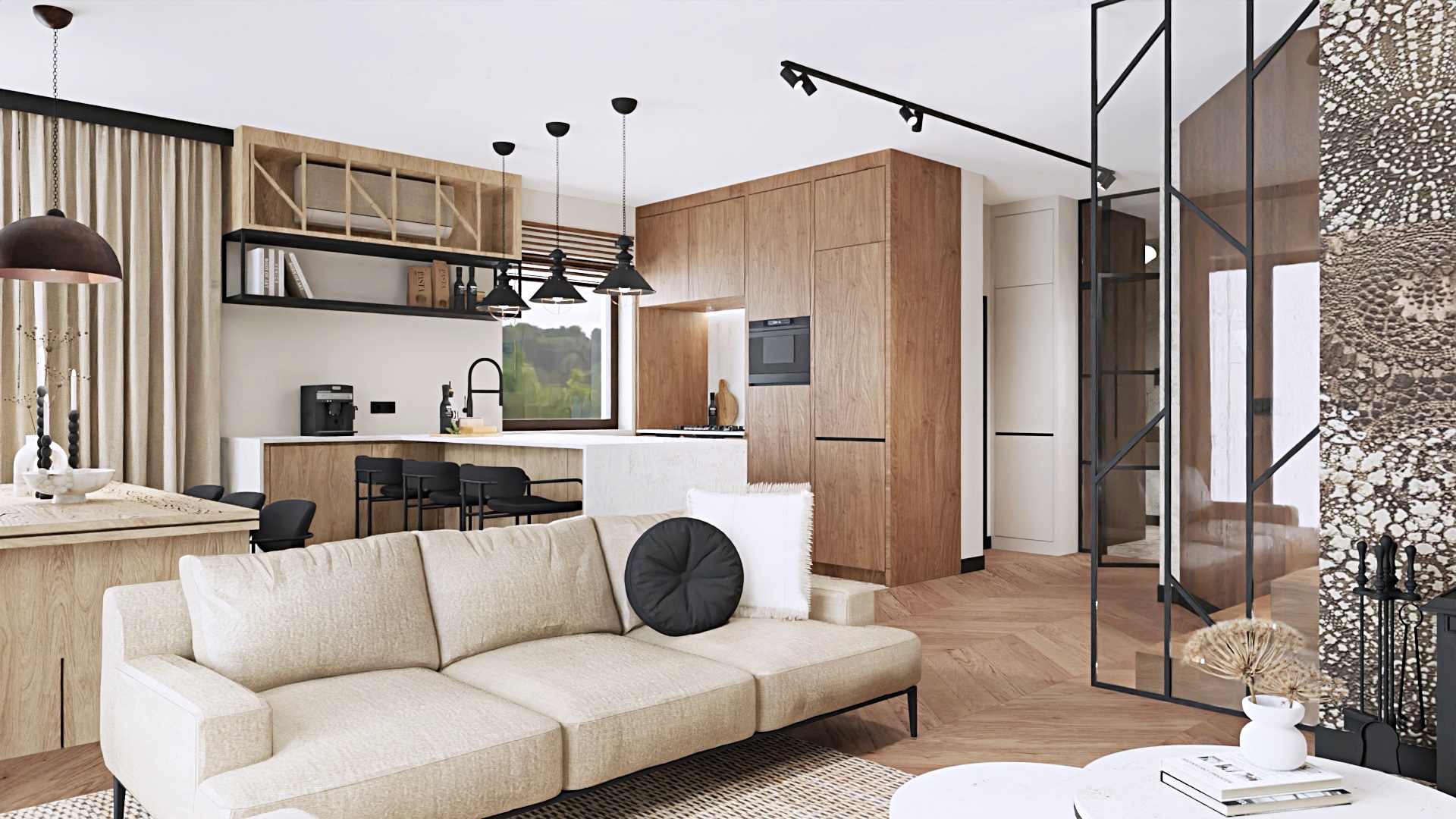 Jasny salon z aneksem kuchennym w stylu nowoczesnym: beżowa sofa modułowa z okrągłą czarną poduszką, drewniana zabudowa kuchenna, czarne lampy wiszące i metalowa ścianka działowa.