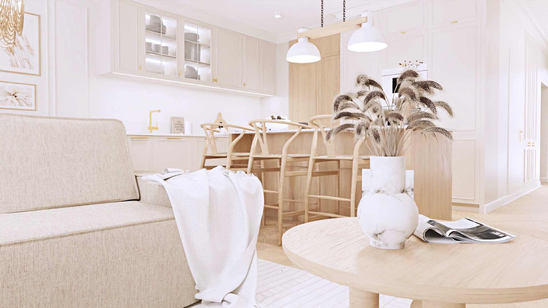 Jasne wnętrze z aneksem kuchennym i drewnianymi hokerami, sofa z narzutą, okrągły stolik z magazynem i dekoracyjnym wazonem z suszonymi trawami.