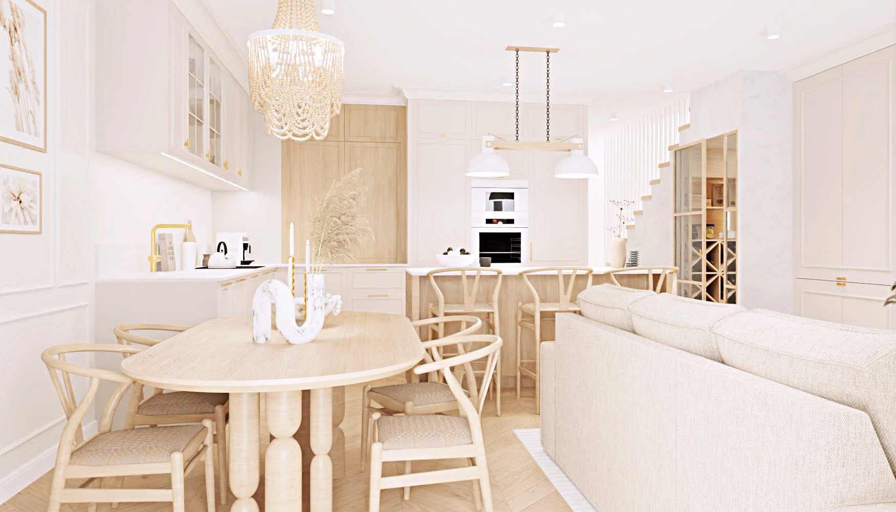 Jasne, przestronne wnętrze z okrągłym stołem jadalnym, drewnianymi krzesłami, beżową sofą i dekoracyjnym żyrandolem z koralików, w tle widoczna kuchnia z wyspą i drewnianymi szafkami.