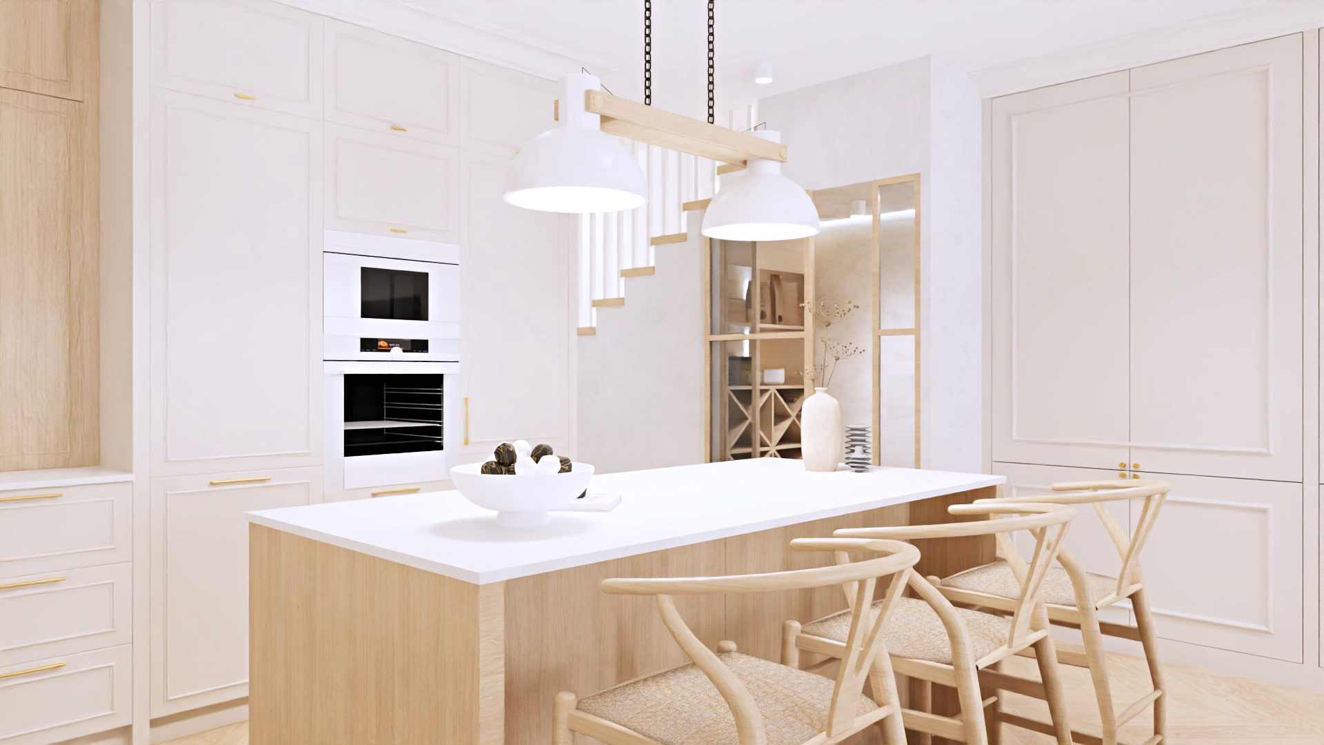 Jasna kuchnia z wyspą, drewnianymi hokerami i zabudową meblową z piekarnikiem; nad wyspą wiszą dwie białe lampy z drewnianym elementem mocującym, w tle widoczna ażurowa półka i schody.