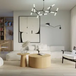 Jasne wnętrze salonu z drewnianą podłogą, białym narożnikiem, okrągłym stolikiem kawowym i krzesłem z czarną ramą, oświetlone nowoczesną lampą sufitową i kinkietem.