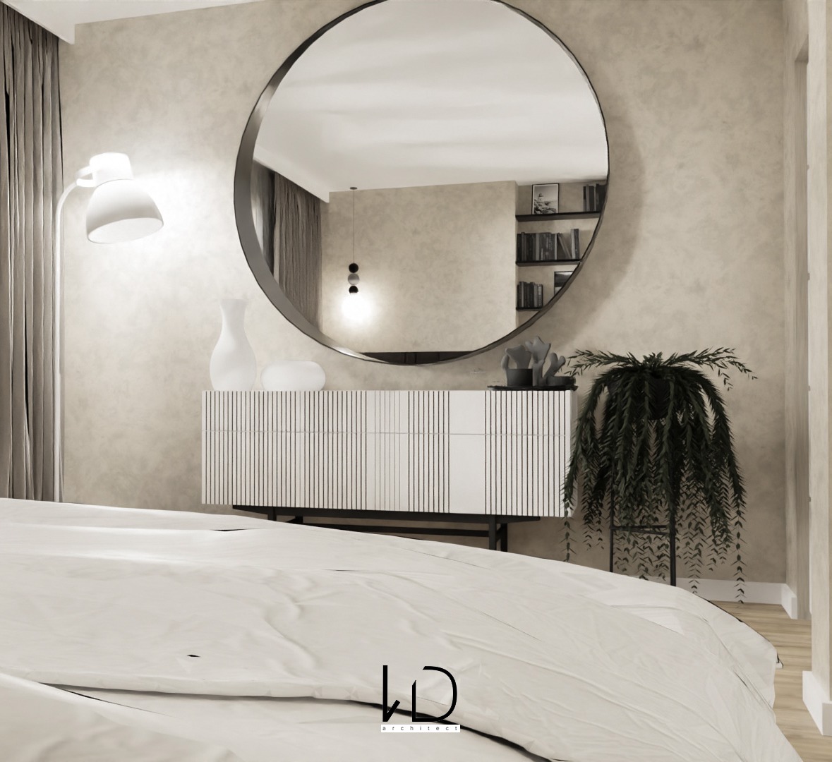 Minimalistyczna sypialnia z dużym okrągłym lustrem, białą komodą z pionowymi żłobieniami, lampą podłogową i rośliną doniczkową, widok zza łóżka z pościelą w odcieniach bieli.