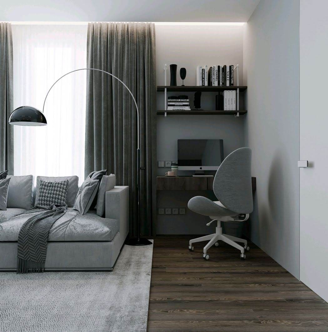 Nowoczesny salon z szarą sofą, lampą łukową, biurkiem z komputerem i drewnianą podłogą, oświetlenie LED na suficie.