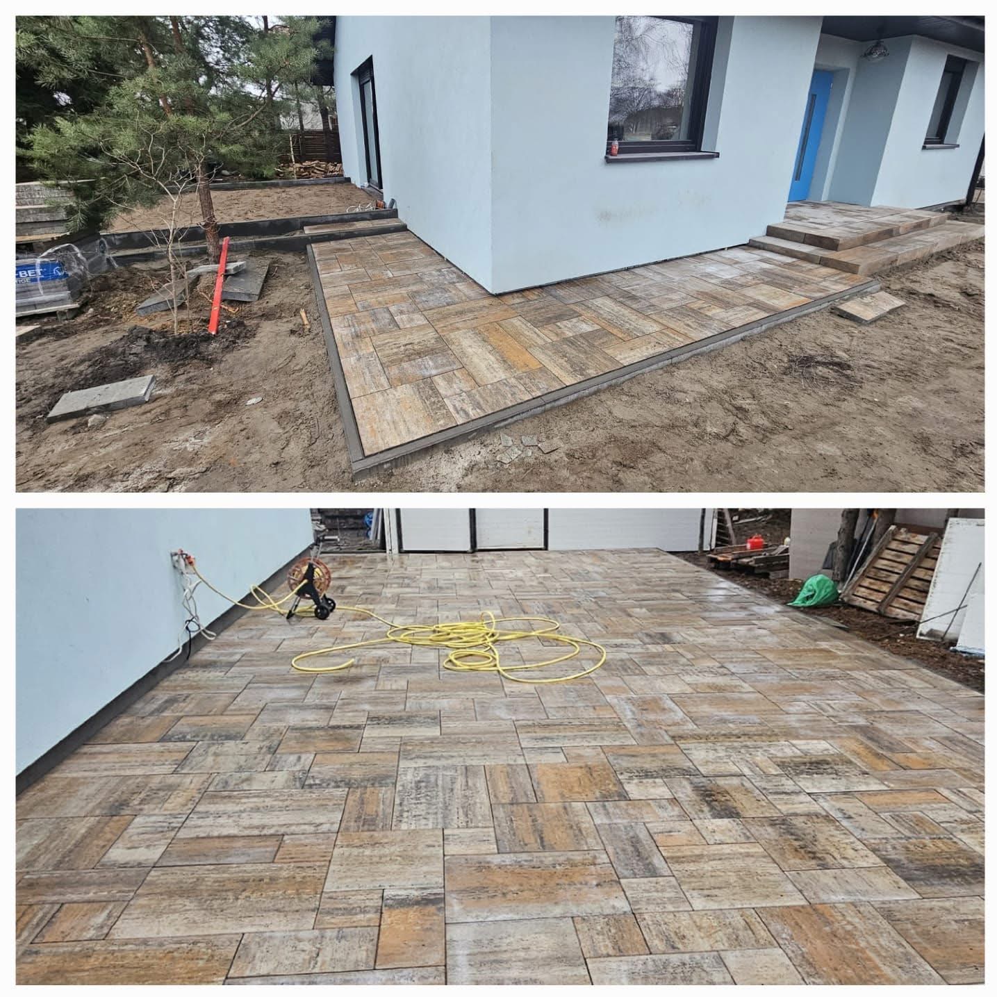 Ukończona ścieżka z kostki brukowej w odcieniach brązu i beżu, prowadząca do jasnego budynku z niebieskimi drzwiami. Widoczne narzędzia i materiały budowlane.