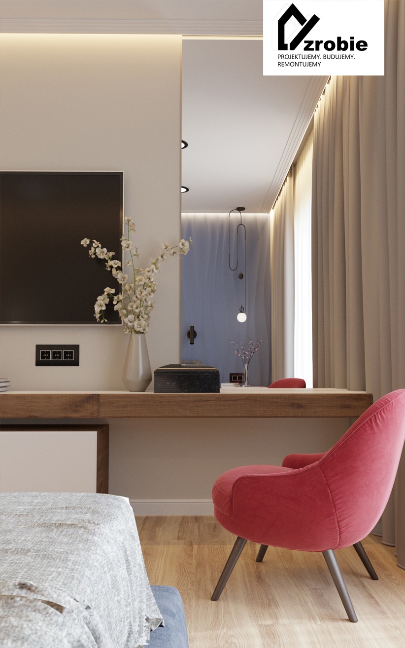 Wnętrze pokoju z telewizorem, biurkiem z drewnianym blatem, czerwonym krzesłem i dekoracyjnym oświetleniem, widoczne logo firmy projektującej.