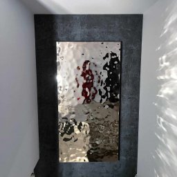 Zabudowa z panelem dekoracyjnym, wkoło wykończona tynkiem dekoracyjnym typu imitacja betonu