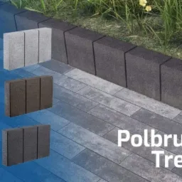 Aranżacja przestrzeni z wykorzystaniem kostki brukowej Polbruk Treo w różnych odcieniach szarości, z obrzeżami rabatowymi i fragmentem trawnika w tle.