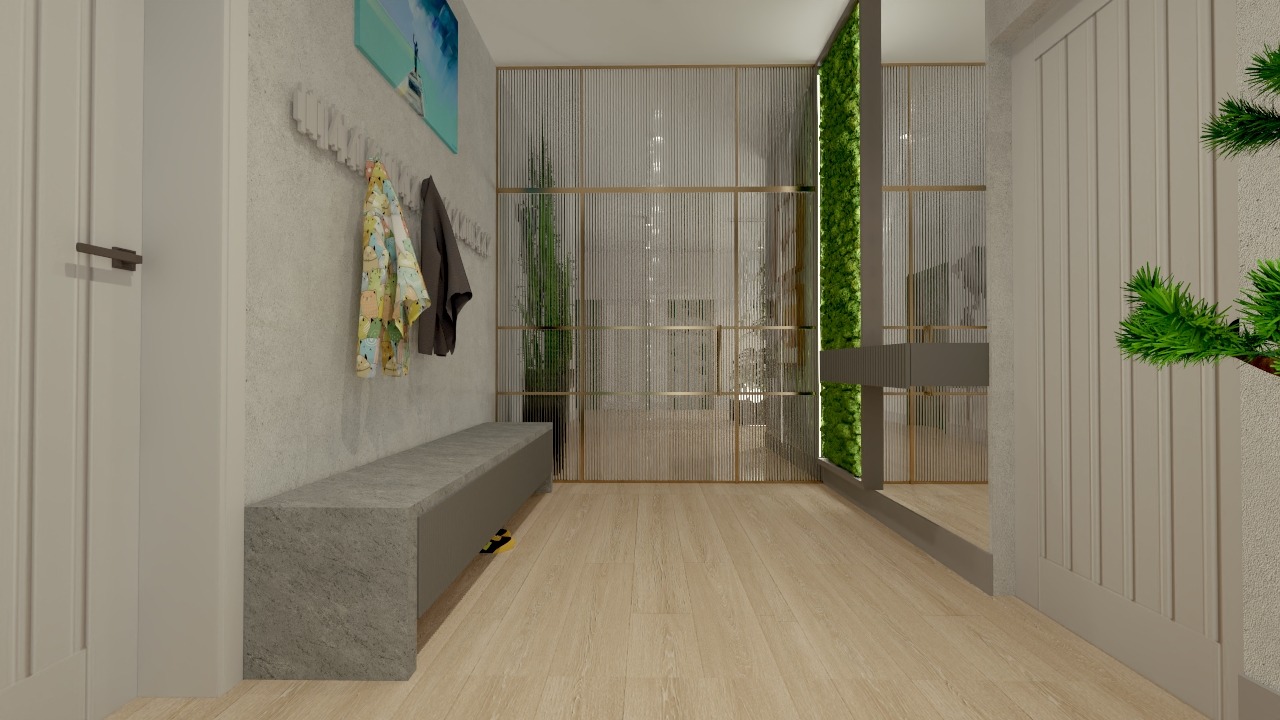 Nowoczesny przedpokój z betonową ławką, wieszakami na ubrania i dekoracyjną ścianką z roślinami oraz przeszkleniami, oświetlony naturalnym światłem.