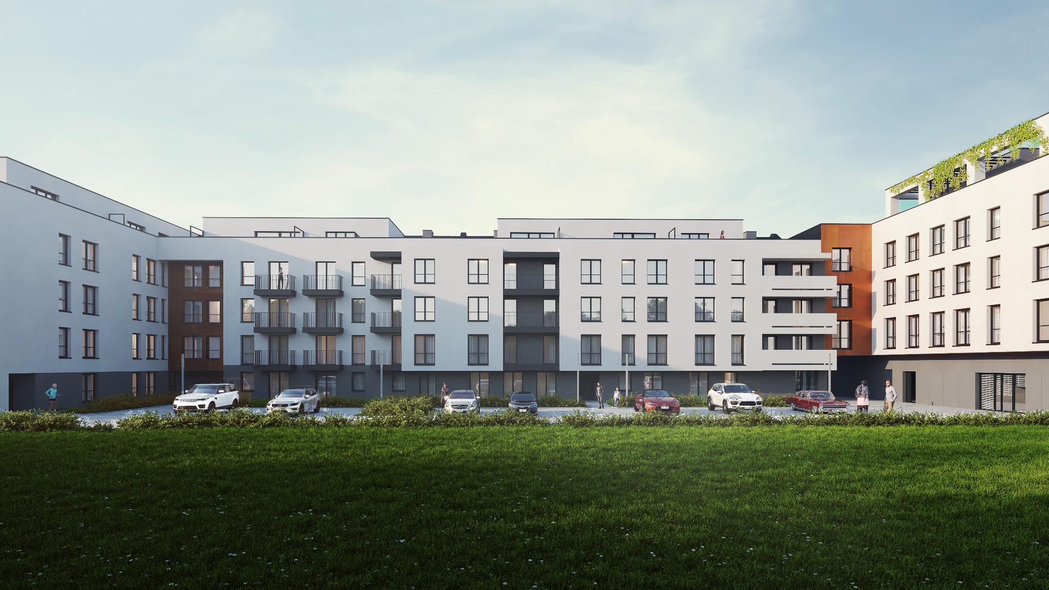 Nowoczesny, trzypiętrowy budynek mieszkalny z białymi ścianami, ciemnymi oknami i balkonami, z elementami wykończenia w kolorze rdzy. Na dachu widoczna zieleń. Na pierwszym planie trawnik...