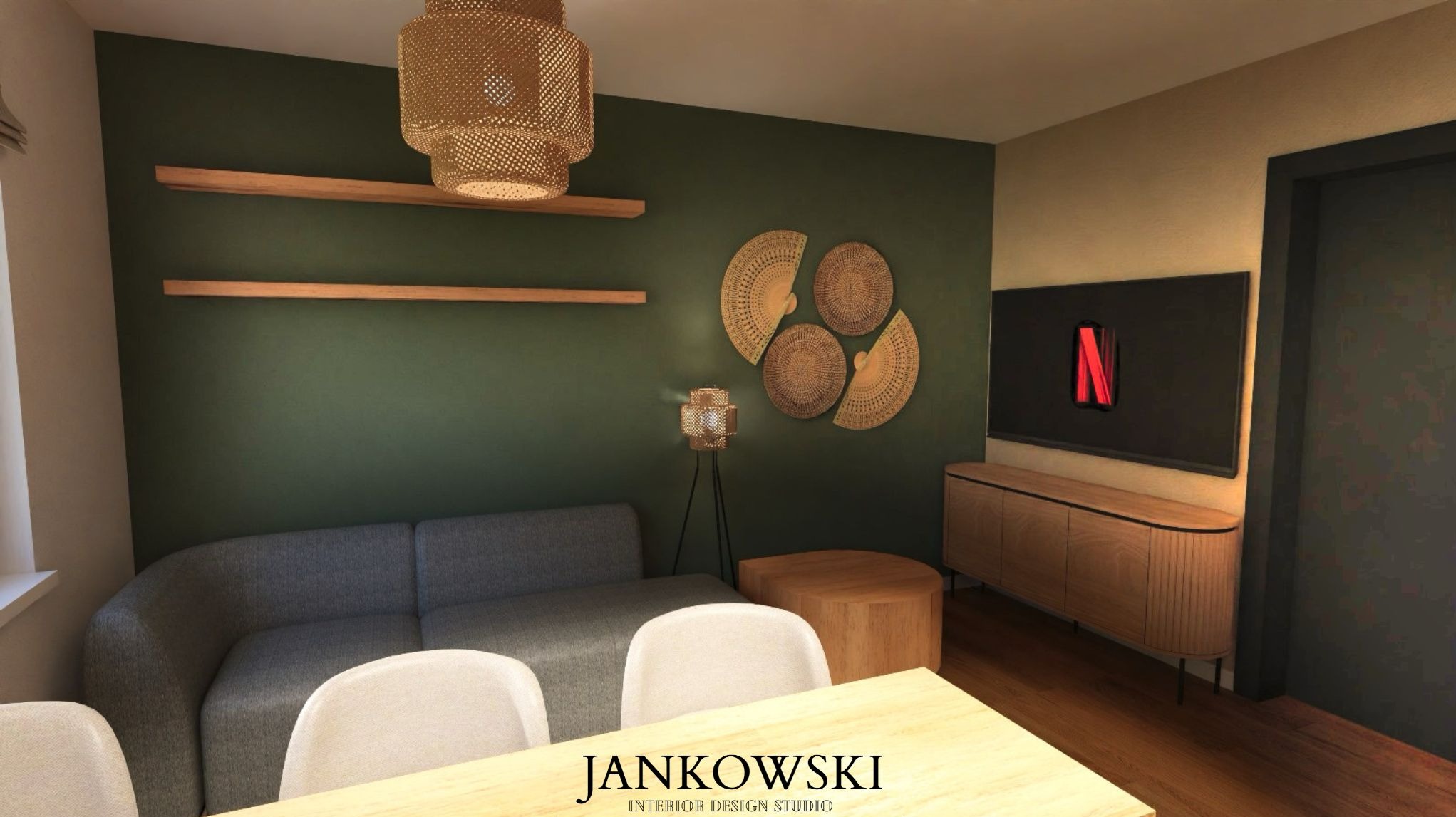 Stylowy salon z zieloną ścianą, drewnianymi półkami i dekoracjami z wikliny. Szara sofa, białe krzesła i drewniany stolik kawowy tworzą przytulną przestrzeń.