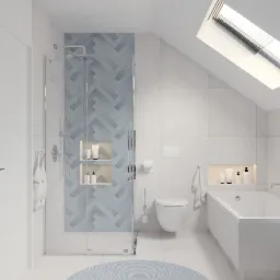 Jasna łazienka na poddaszu z kabiną prysznicową wykończoną błękitną mozaiką w jodełkę, białą wanną, toaletą i okrągłym dywanikiem.