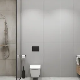 Nowoczesna łazienka z kabiną prysznicową typu walk-in, umywalką nablatową na blacie z półką, okrągłym lustrem i minimalistyczną toaletą podwieszaną.