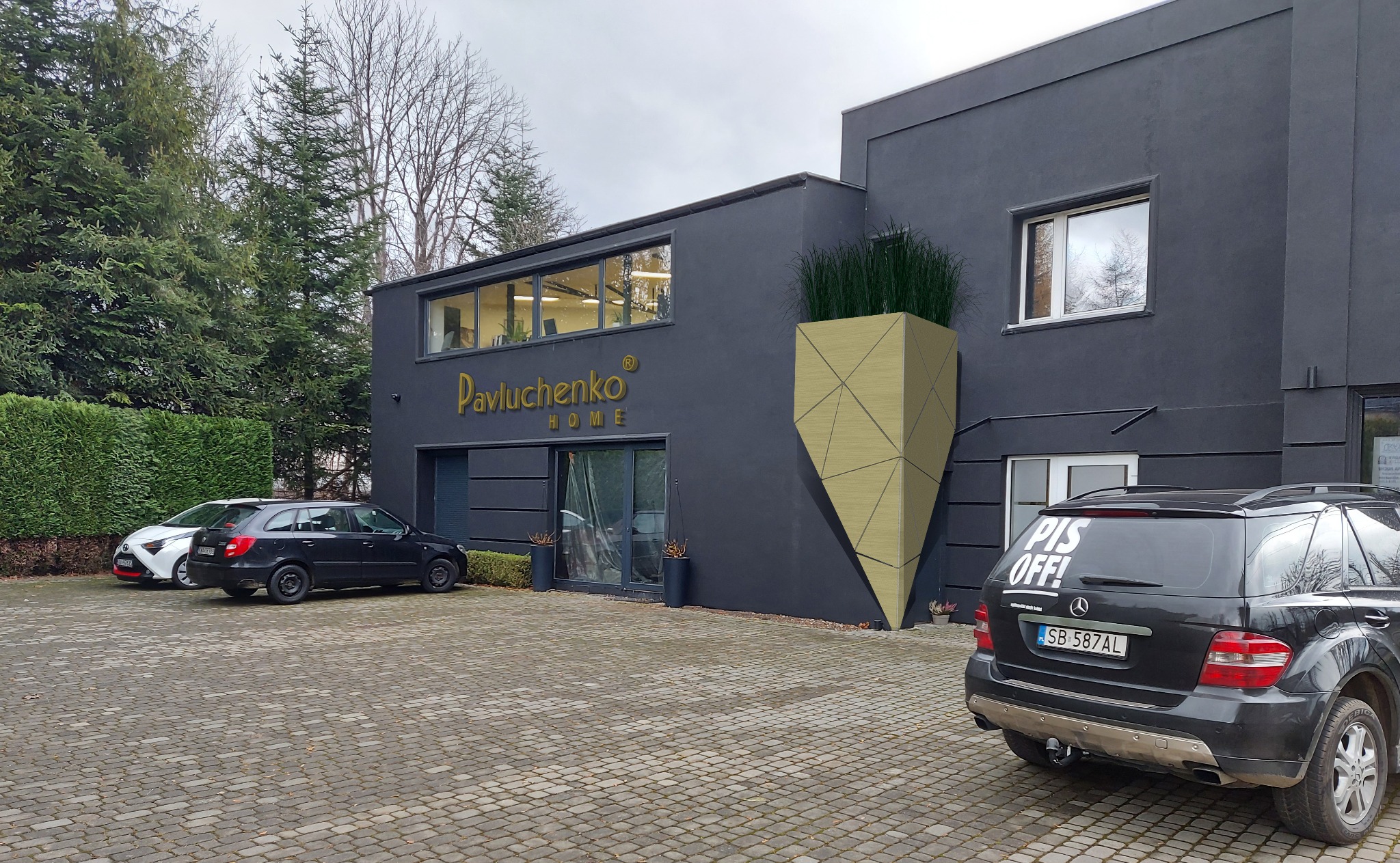 Elewacja nowoczesnego, ciemnoszarego budynku z logo 'Pavluchenko HOME', geometryczną donicą z trawami i zaparkowanymi samochodami na brukowanym podjeździe.