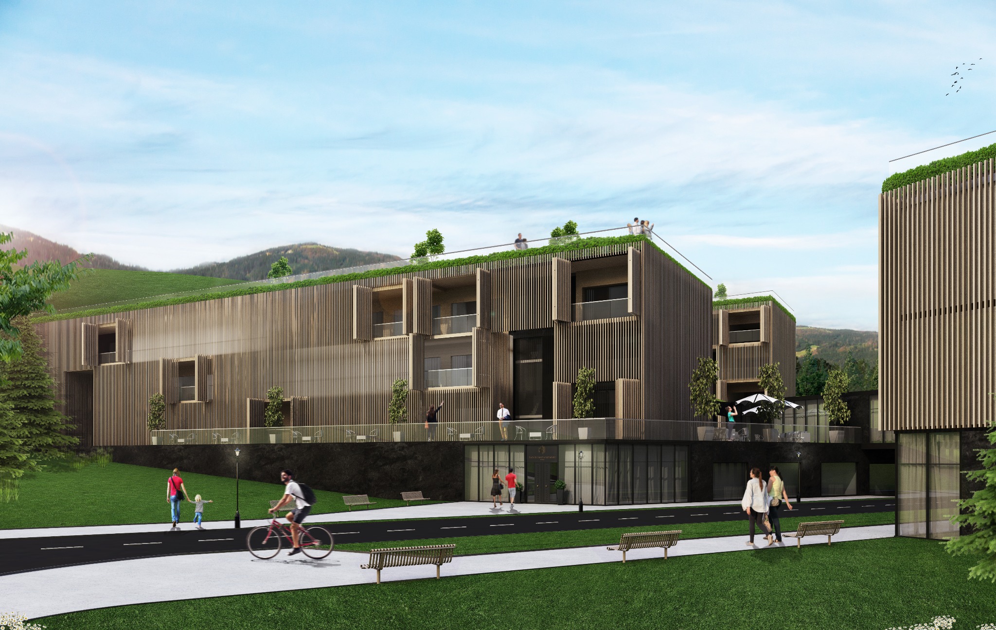 Wizualizacja budynku mieszkalnego z drewnianą elewacją i zielonym dachem, w tle góry, na pierwszym planie spacerujący ludzie i rowerzysta.