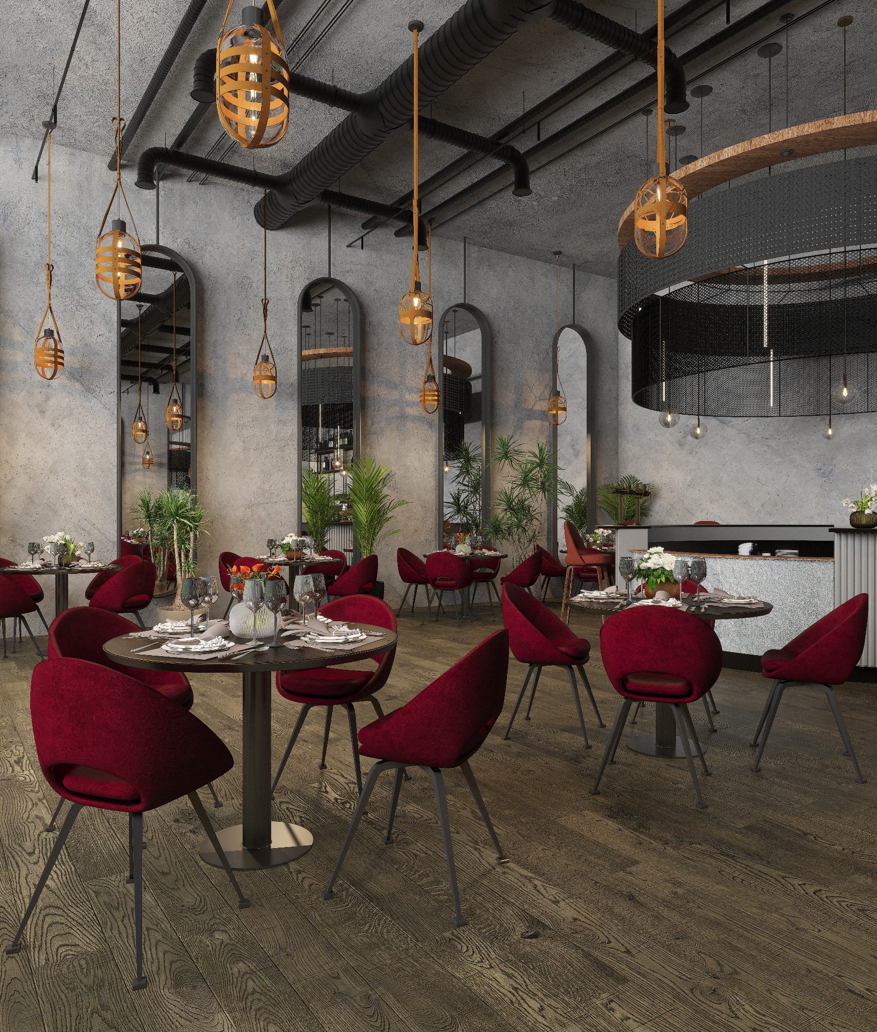 Wnętrze restauracji z surowymi betonowymi ścianami, drewnianą podłogą, czerwonymi krzesłami i stołami z zastawą, oświetlone dekoracyjnymi lampami w stylu industrialnym.