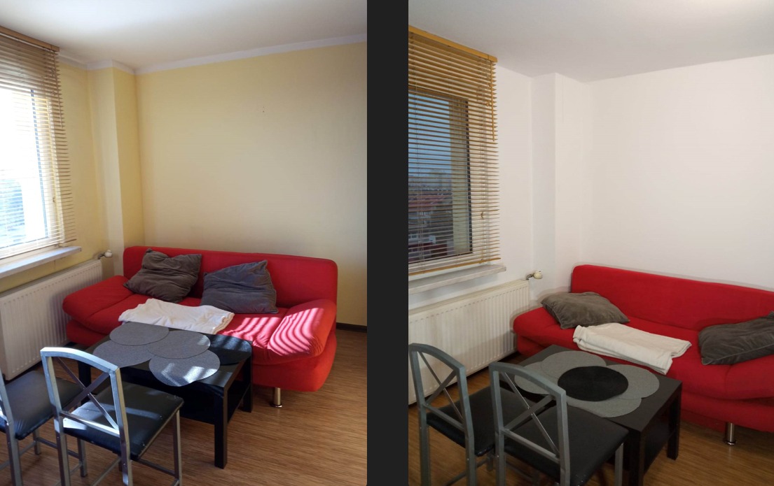 Pokój dzienny po odświeżeniu: ściany pomalowane na biało i jasnożółto, czerwona sofa z szarymi poduszkami, drewniane żaluzje w oknie, czarny stolik kawowy z szarymi podkładkami, drewniana podłoga.