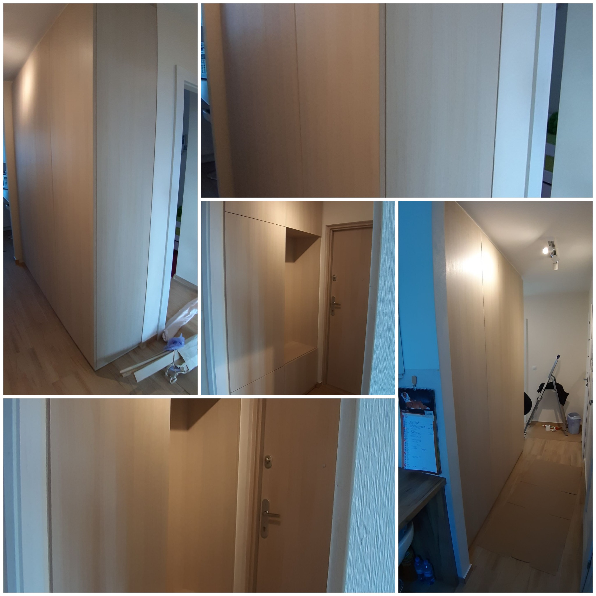 Montaż jasnej szafy wnękowej z drewnianymi drzwiami przesuwnymi w przedpokoju, widoczne drobne niedociągnięcia wykończeniowe i zabezpieczenie podłogi kartonem.