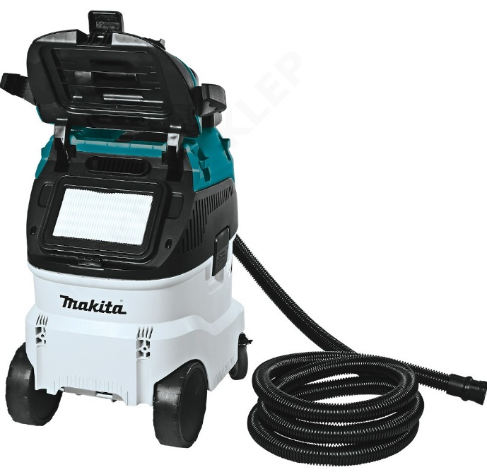 Przemysłowy odkurzacz Makita z otwartą klapą i widocznym filtrem, biało-turkusowa obudowa, czarny wąż zwinięty u podstawy.