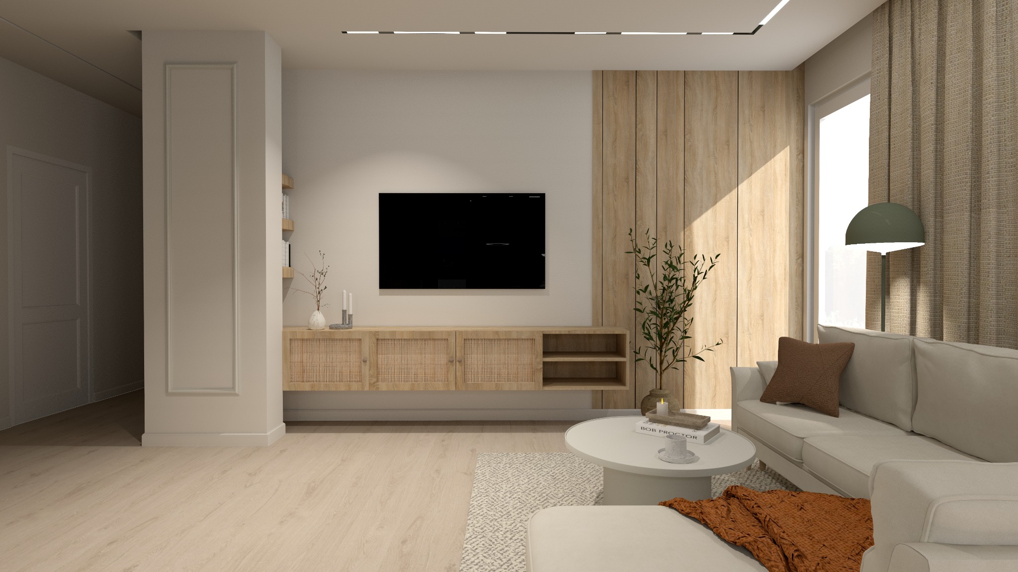 Jasny salon z drewnianą ścianą, telewizorem, rattanową komodą, białym narożnikiem i okrągłym stolikiem kawowym z książkami.