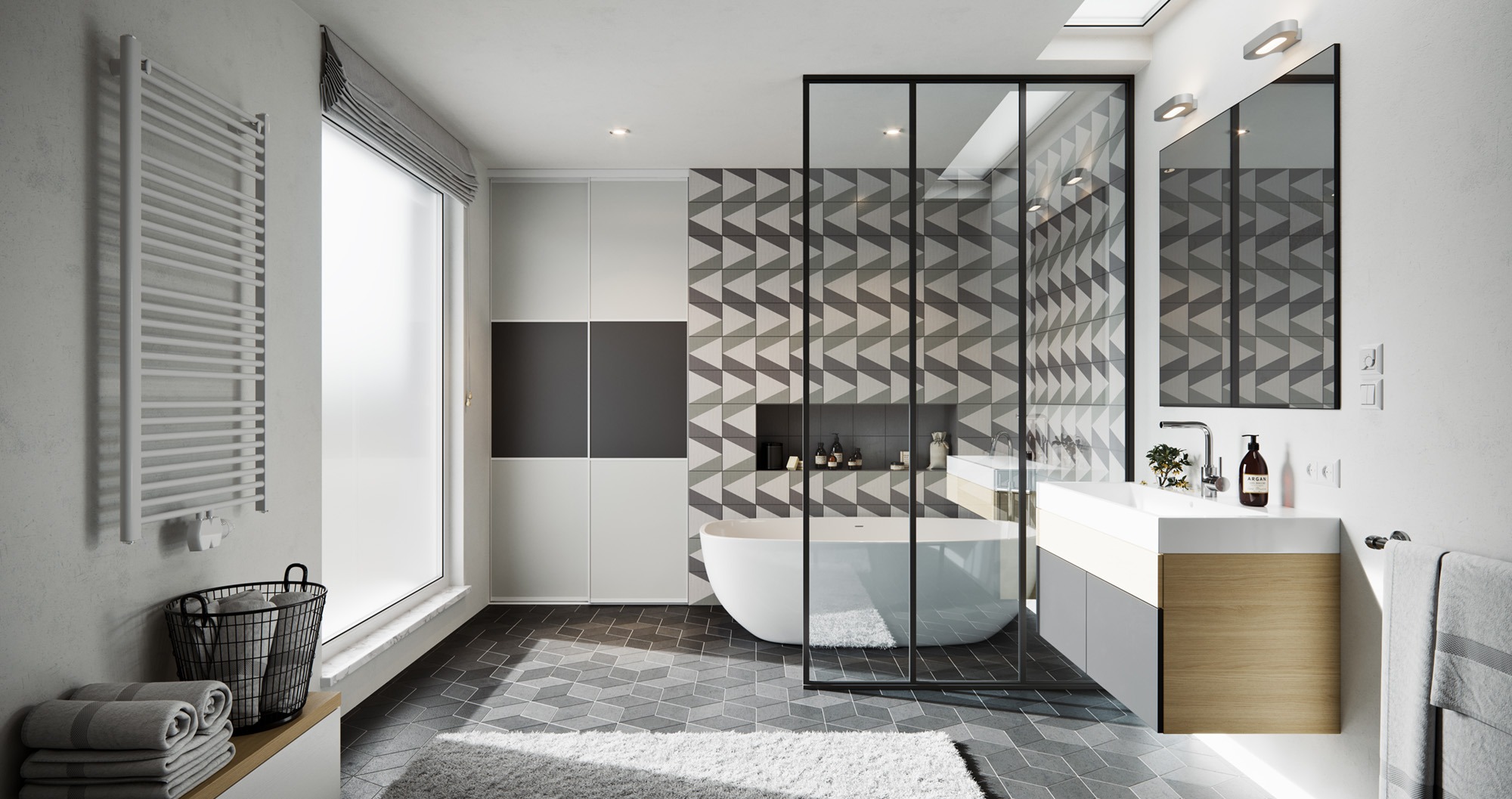 Nowoczesna łazienka z geometrycznymi płytkami, wolnostojącą wanną, szklaną kabiną prysznicową i grzejnikiem drabinkowym, oświetlona światłem dziennym z okna dachowego.