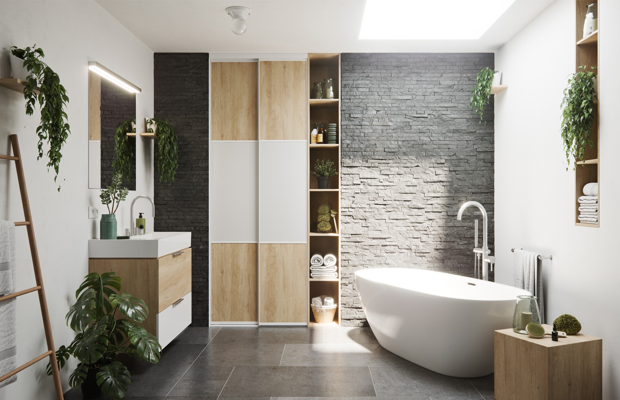 Nowoczesna łazienka z wolnostojącą białą wanną, umywalką z drewnianą szafką, szarą ścianą z kamienia, drewnianymi półkami z dekoracjami i zielonymi roślinami doniczkowymi.