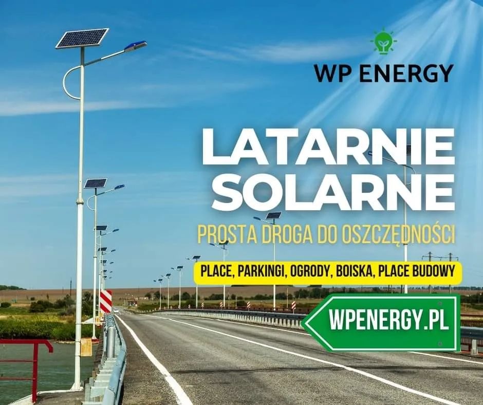 Liniowy układ latarni solarnych w Warszawie, zamontowanych wzdłuż drogi, z widocznym logo firmy WP Energy i hasłem 'Latarnie solarne - prosta droga do oszczędności'.